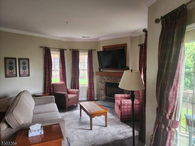 7-11 Maple Cres Unit 11, Vernon Twp, NJ 07462 - living area with healthy amount of natural light, a fireplace, ornamental molding, and wood finished floors