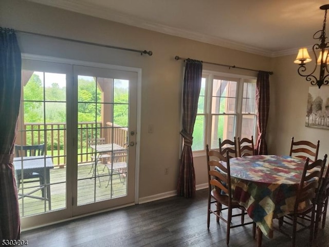 7-11 Maple Cres Unit 11, Vernon Twp, NJ 07462 - dining area featuring healthy amount of natural light, a chandelier, dark wood-style floors, and ornamental molding