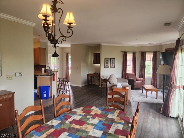 7-11 Maple Cres Unit 11, Vernon Twp, NJ 07462 - dining area with dark wood-type flooring, plenty of natural light, crown molding, and a chandelier