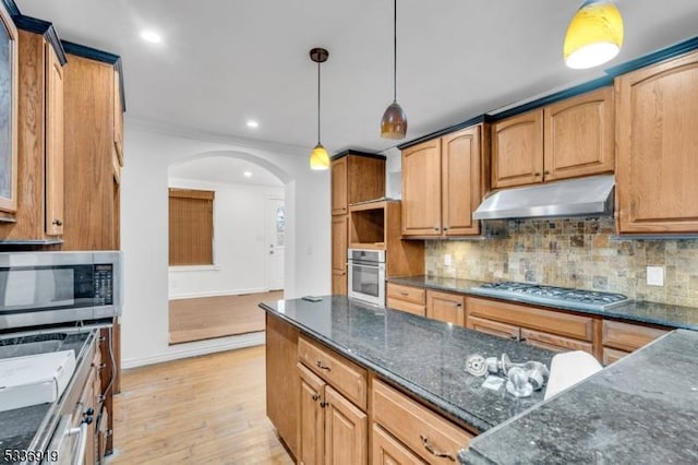 797 Passaic Ave, West Caldwell Twp, NJ 07006 - kitchen featuring stainless steel appliances, under cabinet range hood, arched walkways, tasteful backsplash, and recessed lighting