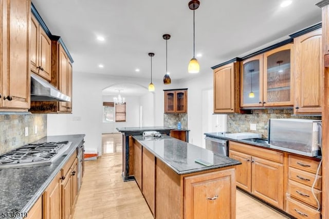 797 Passaic Ave, West Caldwell Twp, NJ 07006 - kitchen with stainless steel appliances, a kitchen island, under cabinet range hood, backsplash, and recessed lighting