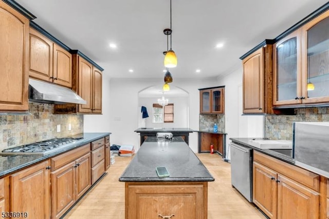 797 Passaic Ave, West Caldwell Twp, NJ 07006 - kitchen featuring stainless steel appliances, under cabinet range hood, arched walkways, backsplash, and a kitchen island