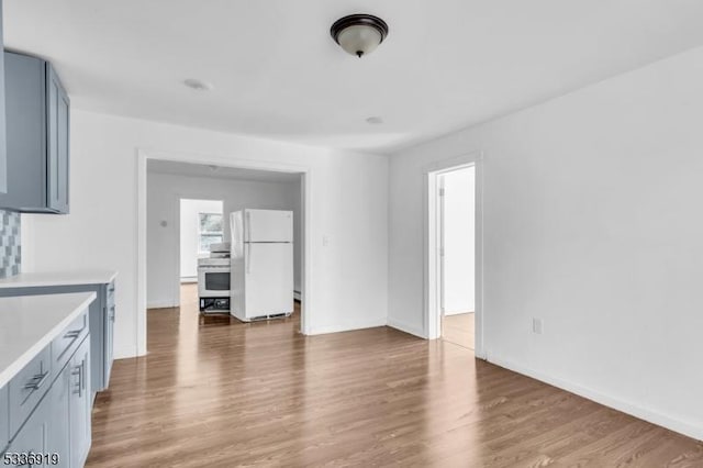 797 Passaic Ave, West Caldwell Twp, NJ 07006 - unfurnished living room featuring wood finished floors and baseboards