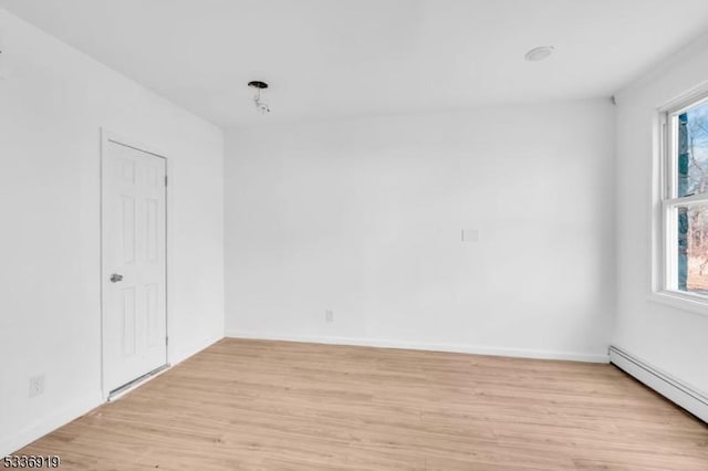 797 Passaic Ave, West Caldwell Twp, NJ 07006 - spare room featuring a baseboard heating unit, plenty of natural light, and light wood-style flooring