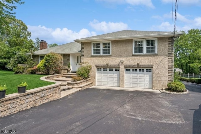 1127 Mountain Ave, Berkeley Heights Twp, NJ 07922 - view of front of house with asphalt driveway, a front lawn, a chimney, stucco siding, and an attached garage