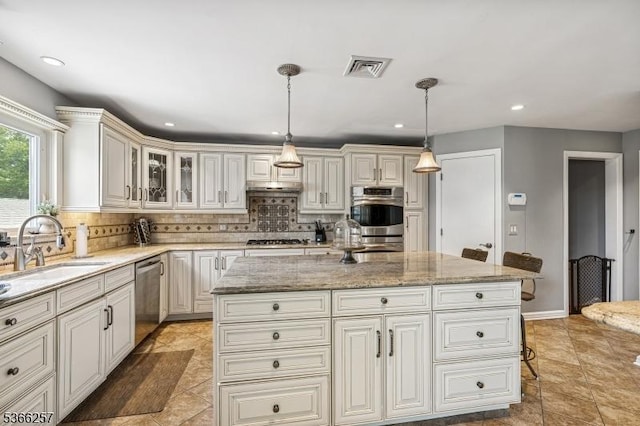 1127 Mountain Ave, Berkeley Heights Twp, NJ 07922 - kitchen with appliances with stainless steel finishes, decorative backsplash, light stone counters, and recessed lighting