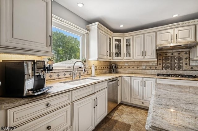 1127 Mountain Ave, Berkeley Heights Twp, NJ 07922 - kitchen featuring stainless steel appliances, tasteful backsplash, light stone counters, under cabinet range hood, and glass insert cabinets
