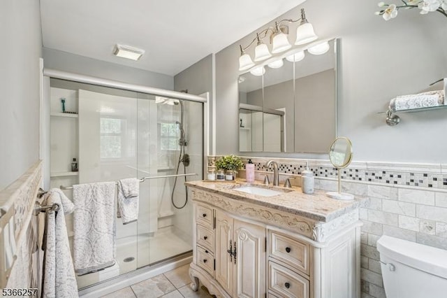 1127 Mountain Ave, Berkeley Heights Twp, NJ 07922 - bathroom with vanity, tile patterned floors, a stall shower, tile walls, and wainscoting