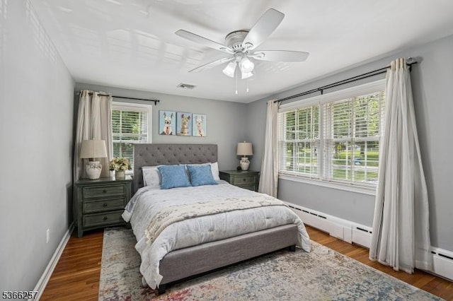 1127 Mountain Ave, Berkeley Heights Twp, NJ 07922 - bedroom featuring a baseboard heating unit, wood finished floors, and a ceiling fan