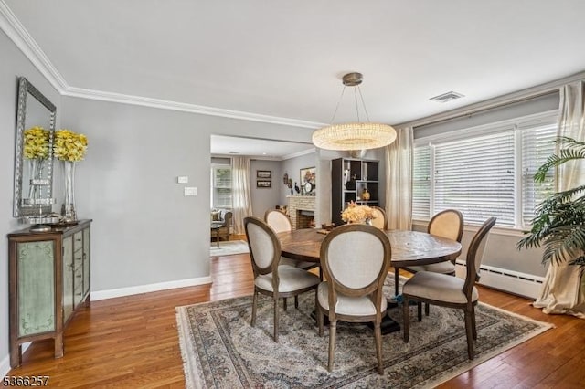 1127 Mountain Ave, Berkeley Heights Twp, NJ 07922 - dining area with a baseboard radiator, wood finished floors, and ornamental molding