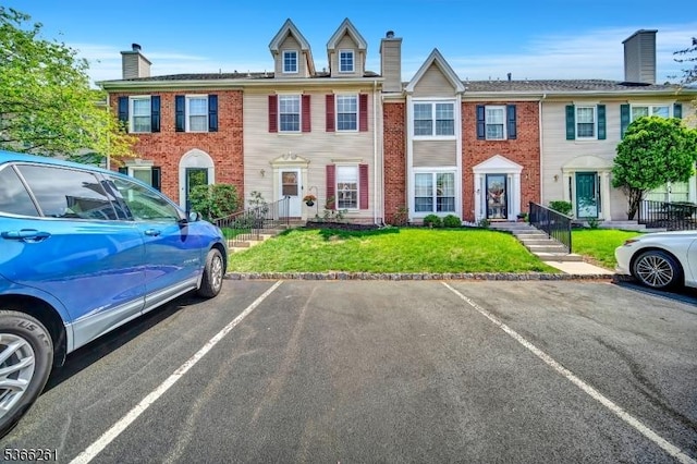 2904 Pinhorn Dr, Bridgewater Twp, NJ 08807 - view of property featuring a chimney, uncovered parking, and brick siding