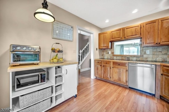 2904 Pinhorn Dr, Bridgewater Twp, NJ 08807 - kitchen with appliances with stainless steel finishes, tasteful backsplash, light wood-style flooring, brown cabinetry, and recessed lighting