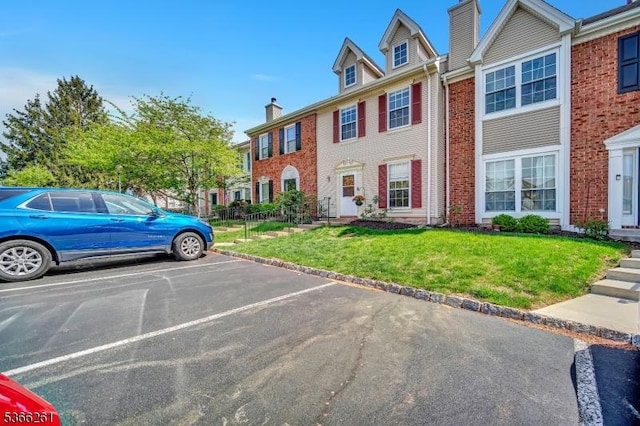 2904 Pinhorn Dr, Bridgewater Twp, NJ 08807 - multi unit property featuring brick siding, a front yard, uncovered parking, and a chimney