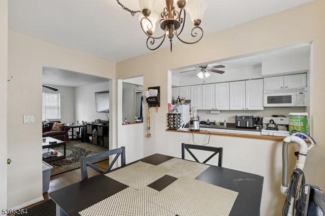 1245B Valley Rd Unit B, Wayne Twp, NJ 07470 - dining space featuring ceiling fan, a chandelier, and wood finished floors