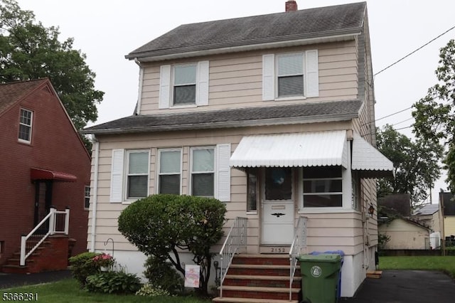 2132 Alberta Ave, Linden City, NJ 07036 - view of front facade featuring entry steps and a chimney