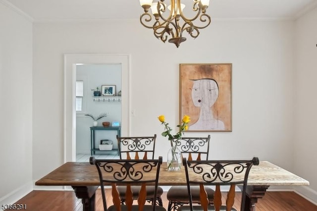 64 Rollinson St, West Orange Twp, NJ 07052 - dining space featuring crown molding, a chandelier, and wood finished floors