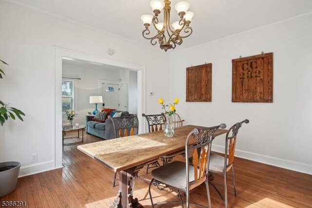 64 Rollinson St, West Orange Twp, NJ 07052 - dining room with hardwood / wood-style floors, a chandelier, and crown molding