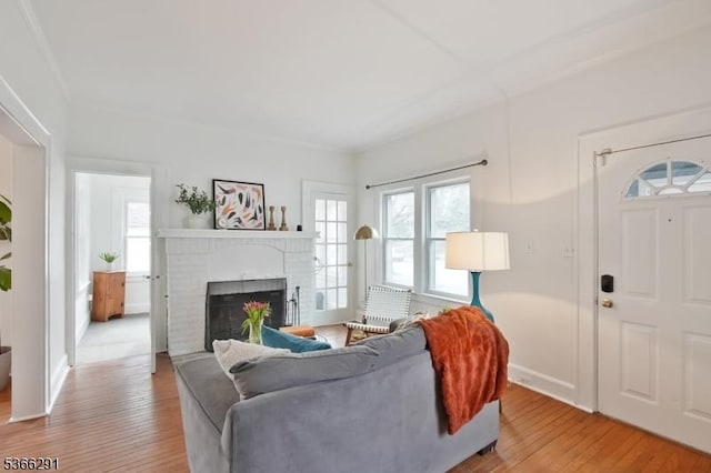 64 Rollinson St, West Orange Twp, NJ 07052 - living area featuring light wood finished floors, healthy amount of natural light, and a fireplace