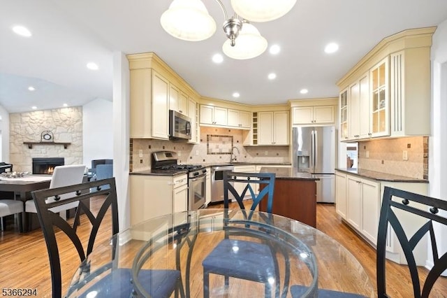 29 Stonegate Dr, Watchung Boro, NJ 07069 - dining space featuring light wood finished floors, a fireplace, and recessed lighting