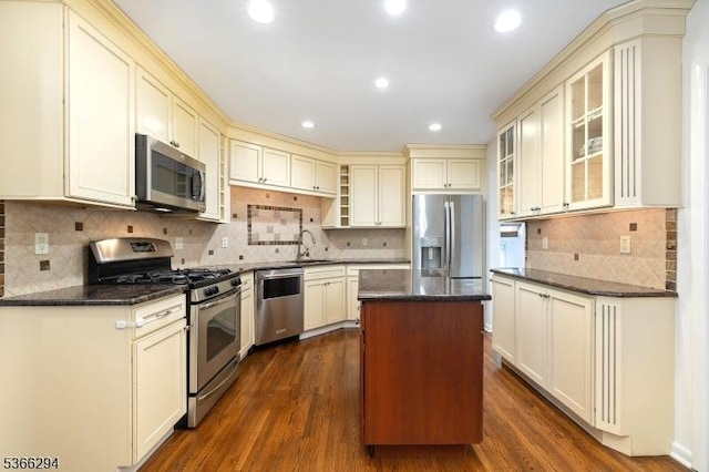 29 Stonegate Dr, Watchung Boro, NJ 07069 - kitchen featuring stainless steel appliances, cream cabinets, a center island, dark wood finished floors, and recessed lighting