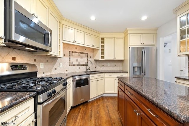 29 Stonegate Dr, Watchung Boro, NJ 07069 - kitchen featuring appliances with stainless steel finishes, cream cabinets, dark wood finished floors, dark stone countertops, and recessed lighting