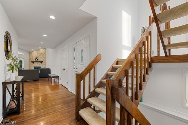 29 Stonegate Dr, Watchung Boro, NJ 07069 - staircase with wood finished floors, a fireplace, and recessed lighting