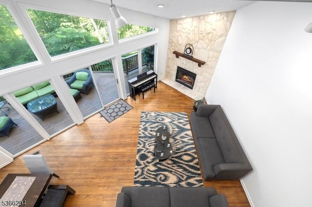 29 Stonegate Dr, Watchung Boro, NJ 07069 - living room with a stone fireplace, wood finished floors, and vaulted ceiling
