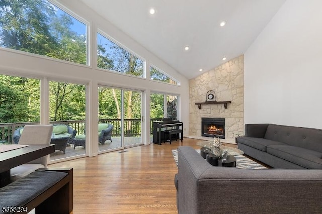 29 Stonegate Dr, Watchung Boro, NJ 07069 - living room with high vaulted ceiling, wood finished floors, a stone fireplace, and recessed lighting