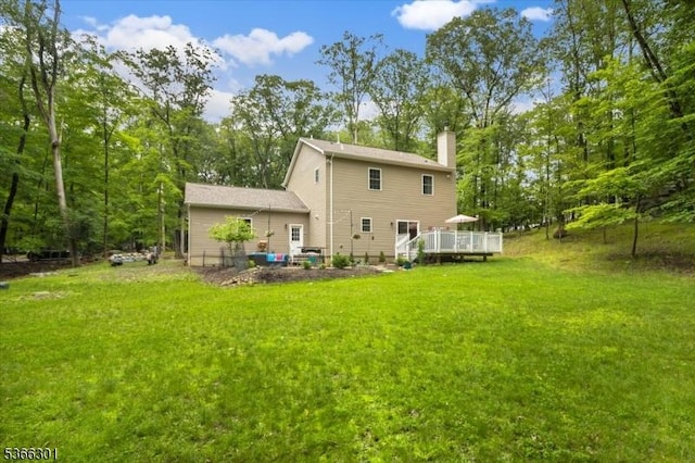 4 Kisling Ave, Hopatcong Boro, NJ 07843 - rear view of property featuring a chimney, a deck, and a yard