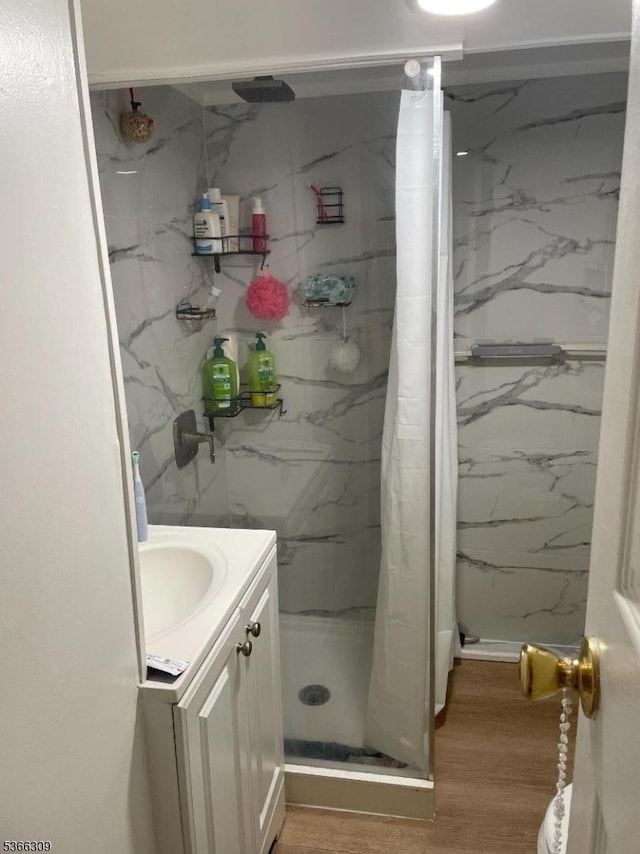 16 Sale St, Moonachie Boro, NJ 07074 - full bath with a marble finish shower, vanity, and wood finished floors
