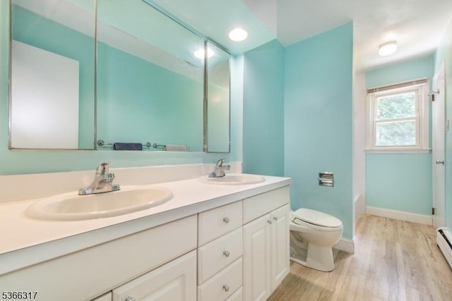 34 Copperfield Rd, Scotch Plains Twp, NJ 07076 - full bath with double vanity, wood finished floors, a shower, and baseboard heating