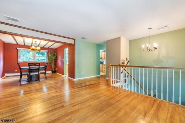 34 Copperfield Rd, Scotch Plains Twp, NJ 07076 - empty room featuring a chandelier and wood finished floors