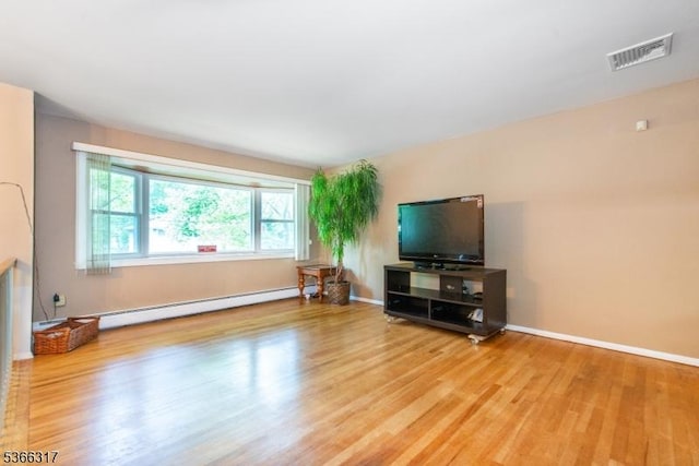 34 Copperfield Rd, Scotch Plains Twp, NJ 07076 - living room featuring baseboard heating and light wood-type flooring