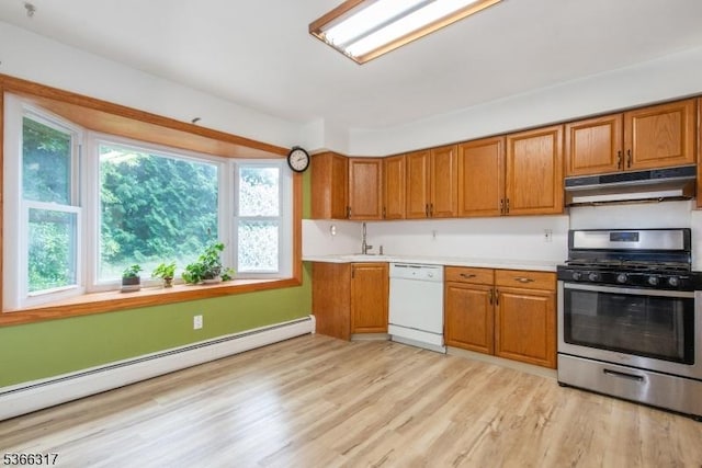 34 Copperfield Rd, Scotch Plains Twp, NJ 07076 - kitchen featuring white dishwasher, stainless steel gas range, a baseboard heating unit, under cabinet range hood, and brown cabinetry