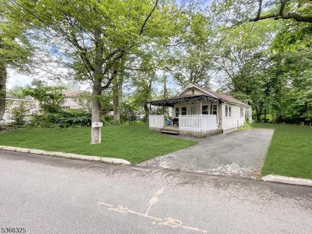 208 Fayette Ave, Wayne Twp, NJ 07470 - shotgun-style home featuring covered porch, a front lawn, and driveway