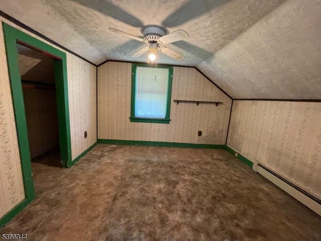 196 Rockport Rd, Mansfield Twp, NJ 07865 - additional living space with baseboard heating, lofted ceiling, carpet flooring, ceiling fan, and a textured ceiling