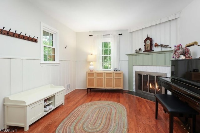 924 Maurice Ave, Rahway City, NJ 07065 - living area with a wainscoted wall, a brick fireplace, and wood finished floors