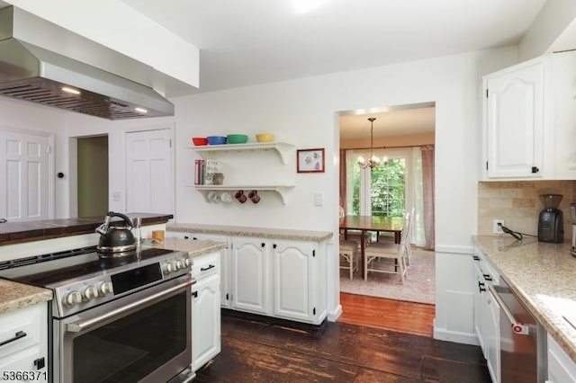 924 Maurice Ave, Rahway City, NJ 07065 - kitchen with stainless steel appliances, wall chimney exhaust hood, dark wood finished floors, white cabinets, and a chandelier