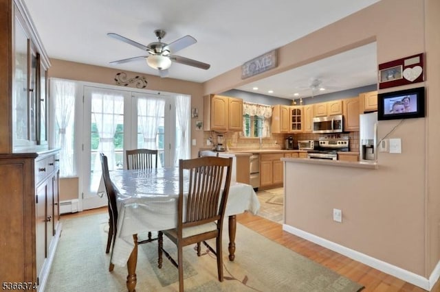 11 Ayers Ci, Andover Twp, NJ 07860 - dining room featuring a ceiling fan, a baseboard heating unit, and light wood finished floors