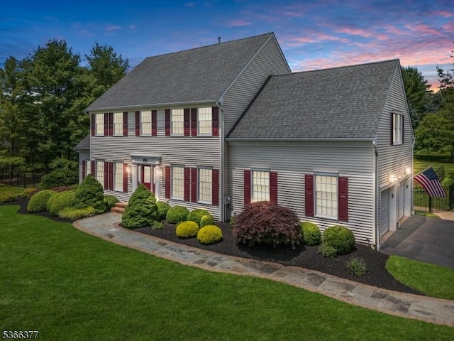 4 Coryell Ct, Raritan Twp, NJ 08822 - colonial inspired home featuring a shingled roof, a front yard, asphalt driveway, and a garage