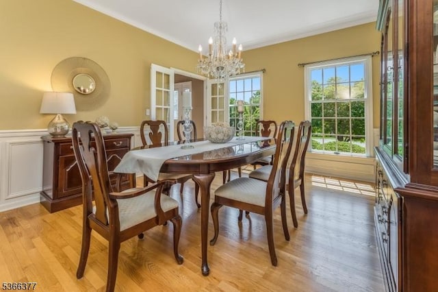4 Coryell Ct, Raritan Twp, NJ 08822 - dining area with a chandelier, light wood-style flooring, a wainscoted wall, and crown molding