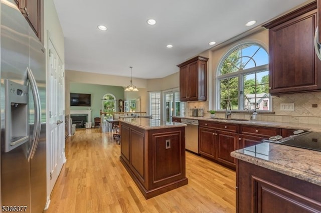4 Coryell Ct, Raritan Twp, NJ 08822 - kitchen with appliances with stainless steel finishes, light wood-style flooring, decorative backsplash, a kitchen island, and recessed lighting