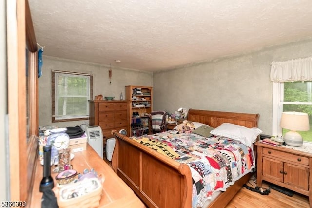 8 Ridge Rd, Independence Twp, NJ 07840 - bedroom with light wood-style flooring and a textured ceiling