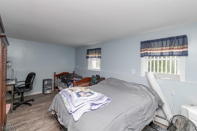 8 Ridge Rd, Independence Twp, NJ 07840 - bedroom featuring multiple windows, wood finished floors, a baseboard radiator, and a desk