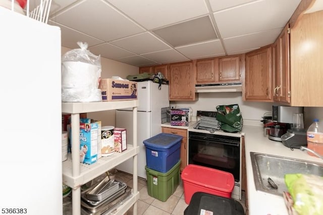 8 Ridge Rd, Independence Twp, NJ 07840 - kitchen featuring under cabinet range hood, stove, a paneled ceiling, light countertops, and freestanding refrigerator