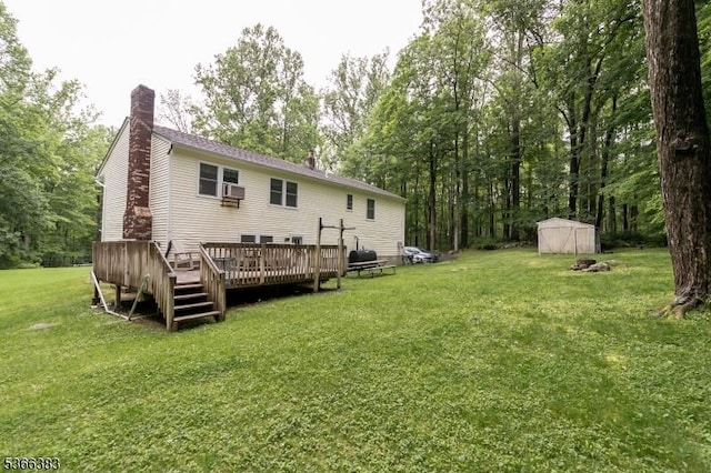 8 Ridge Rd, Independence Twp, NJ 07840 - rear view of house featuring a chimney, a lawn, a storage shed, a deck, and cooling unit