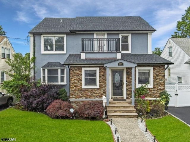 980 Moessner Ave, Union Twp, NJ 07083 - view of front of house featuring a balcony, stucco siding, stone siding, and a shingled roof