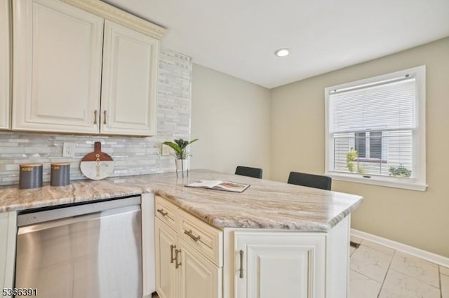 980 Moessner Ave, Union Twp, NJ 07083 - kitchen with dishwasher, a peninsula, light marble finish flooring, tasteful backsplash, and light stone counters