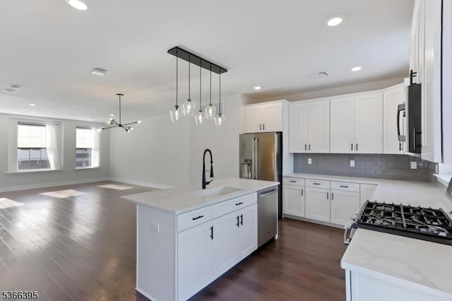 26 Gerhard, Morris Twp, NJ 07960 - kitchen with appliances with stainless steel finishes, open floor plan, backsplash, decorative light fixtures, and dark wood-style flooring