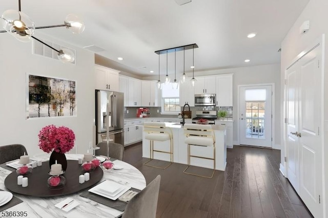 26 Gerhard, Morris Twp, NJ 07960 - kitchen with appliances with stainless steel finishes, light countertops, a kitchen island with sink, white cabinetry, and recessed lighting